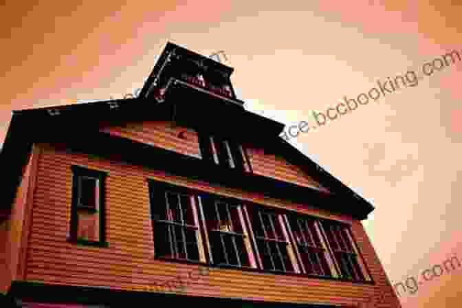 A Haunting Image Of An Old Schoolhouse With Eerie Lights And Shadows, Hinting At The Unsettling Events That Unfold Within Its Walls. An Uneasy Guest In The Schoolhouse: Art Education From Colonial Times To A Promising Future