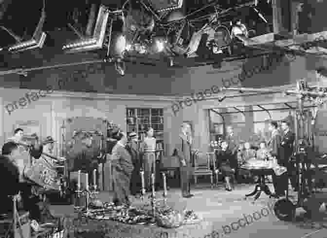 Alfred Hitchcock Standing On A Film Set, Surrounded By Crew Members Hitchcock S Stars: Alfred Hitchcock And The Hollywood Studio System