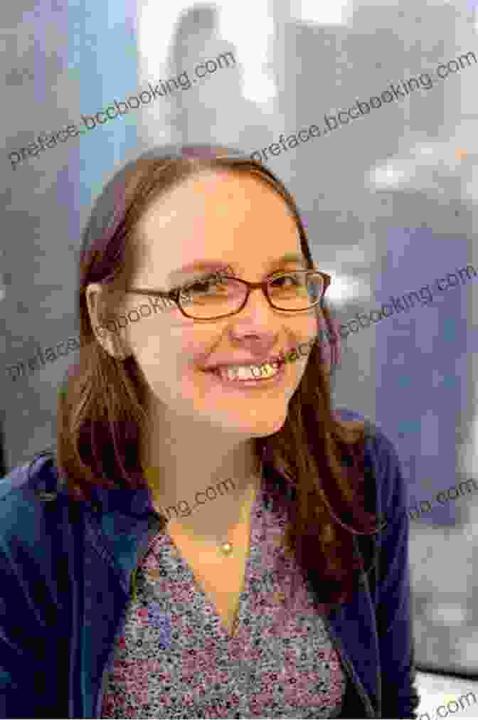 Raina Telgemeier, A Renowned Graphic Novelist, Poses With A Warm Smile, Her Signature Brown Curls Framing Her Face. Drama: A Graphic Novel Raina Telgemeier